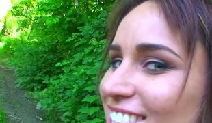 Pretty legal age teenager with blue eyes is naked and engulfing dick in the forest