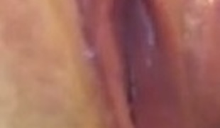 Perverted bitch showing pink soaking vagina in closeup shot